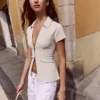 Camiseta de manga corta con cremallera – Mujer Camiseta de manga corta con cremallera – Mujer