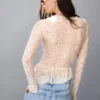 Camiseta de manga larga con volantes de encaje rubio