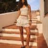 Minifalda con volantes y cinturilla con pedrería Minifalda con volantes y cinturilla con pedrería