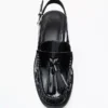 Mocasines sin talón con borlas