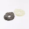 Pack de 2 gomas para el pelo con bordado suizo Pack de 2 gomas para el pelo con bordado suizo