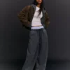 Pantalones de corte acampanado con topes – Pantalones