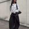 Pantalones plisados con doble botón Pantalones plisados con doble botón
