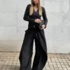 Pantalones plisados con doble botón Pantalones plisados con doble botón