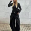 Pantalones plisados con doble botón Pantalones plisados con doble botón