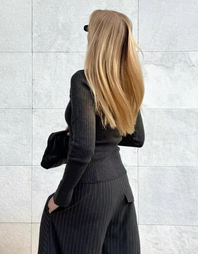 Pantalones plisados con doble botón Pantalones plisados con doble botón