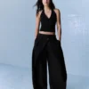 Pantalones plisados con doble botón – Pantalones