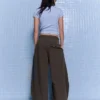 Pantalones plisados con doble botón – Pantalones