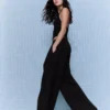 Pantalones plisados con doble botón – Pantalones