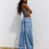 Vaqueros de talle bajo y pierna Wide Leg con botones delanteros – Pantalones